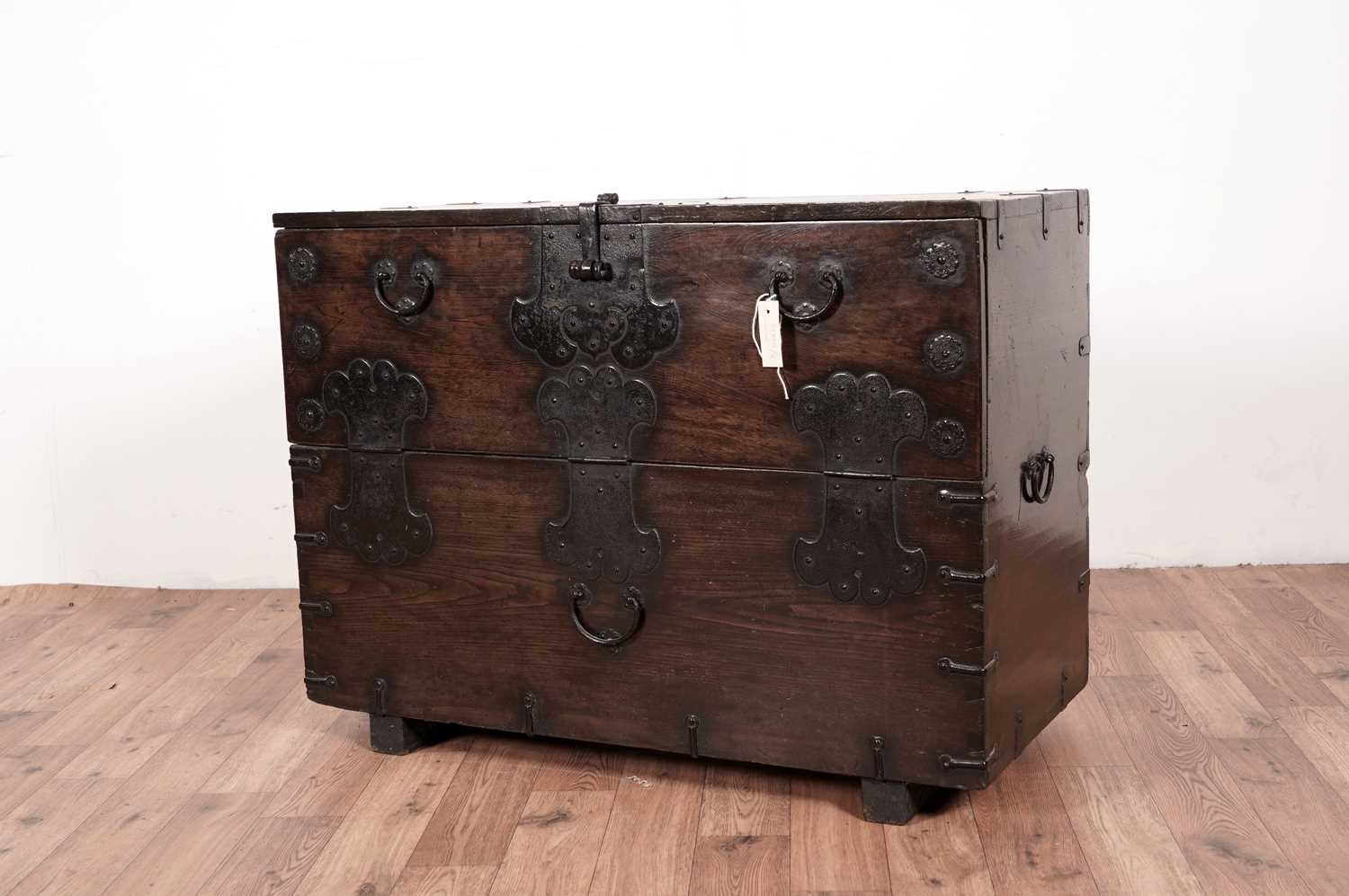 Lot 56 - A 20th Century Chinese hardwood and metal bound chest