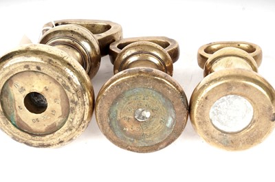 Lot 86 - A harlequin set of antique brass bell weights