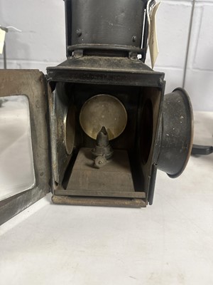 Lot 44 - A black painted cast metal railway lantern