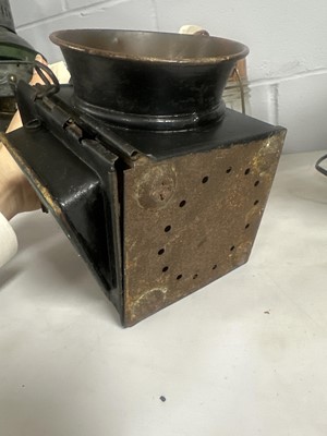 Lot 44 - A black painted cast metal railway lantern