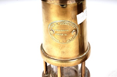 Lot 87 - Three brass miners safety lamps