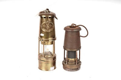 Lot 90 - Two brass miners safety lamps