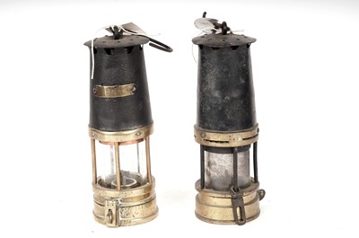 Lot 92 - A brass and black painted miners safety lamp; and another
