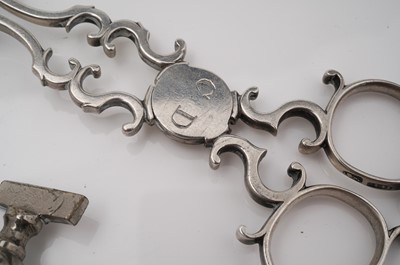 Lot 406 - A pair of Georgian silver sugar tongs and a metal tap