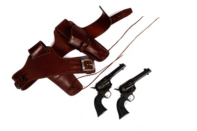 Lot 871 - A pair of cowboy quick-draw pistols in a leather holster