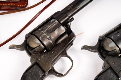 Lot 871 - A pair of cowboy quick-draw pistols in a leather holster