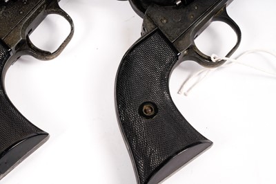 Lot 871 - A pair of cowboy quick-draw pistols in a leather holster
