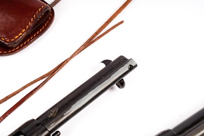 Lot 871 - A pair of cowboy quick-draw pistols in a leather holster
