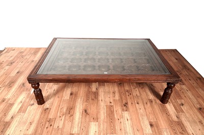 Lot 41 - An Asian hardwood coffee table from Barker & Stonehouse