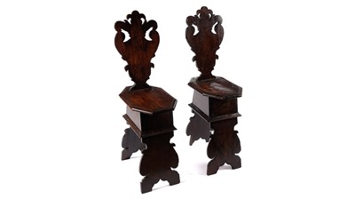 Lot 950 - A pair of Italian walnut hall chairs