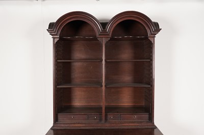 Lot 69 - A Georgian style oak double dome bookcase cabinet