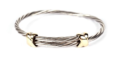 Lot 1228 - Tiffany & Co: a silver and 18ct yellow gold bangle