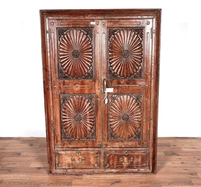 Lot 42 - An Anglo-Indian style carved hardwood doored mirror