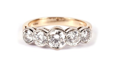 Lot 1236 - A five stone diamond ring