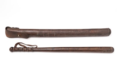 Lot 886 - An early 20th Century mounted police truncheon with sprung leather saddle-mounting case