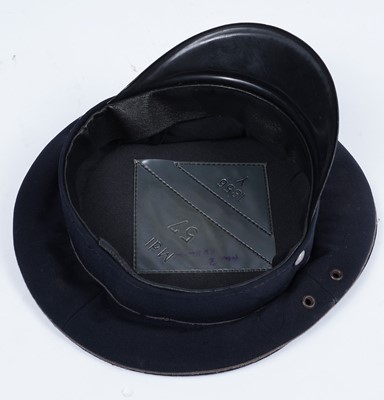 Lot 806 - A woollen guards jacket and peaked cap