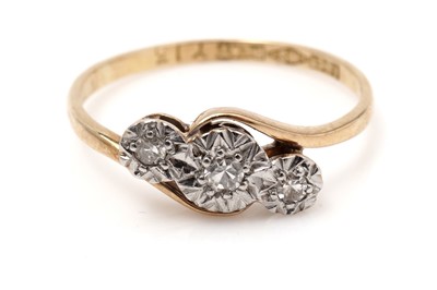 Lot 427 - A three stone diamond ring