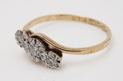 Lot 427 - A three stone diamond ring