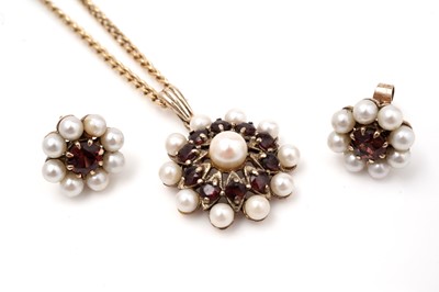 Lot 419 - A garnet and cultured pearl pendant and a pair of similar earrings