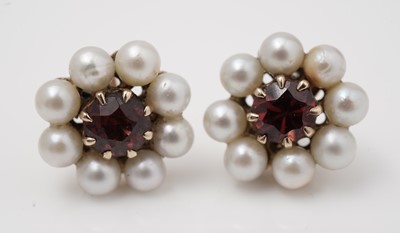 Lot 419 - A garnet and cultured pearl pendant and a pair of similar earrings