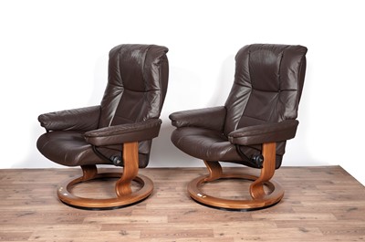 Lot 24 - Ekornes: A pair of leather reclining armchairs
