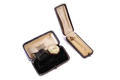 Lot 424 - A 1920s rose gold wristwatch; and two stick pins