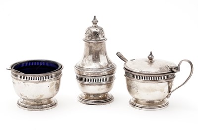 Lot 616 - A George V three piece silver condiment set