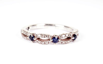 Lot 1073 - Vera Wang, Love: a sapphire and diamond half hoop eternity ring