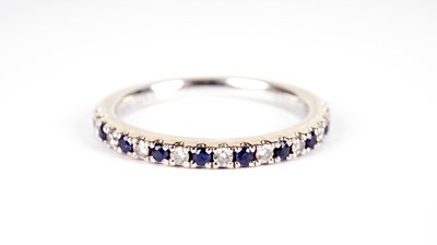 Lot 1079 - Vera Wang, Love: a sapphire and diamond half hoop eternity ring