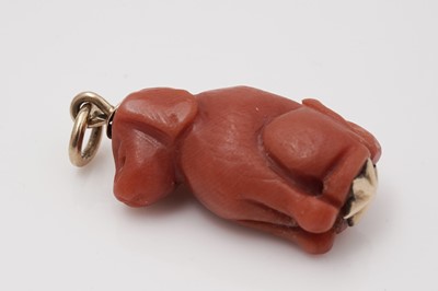 Lot 417 - A carved coral dog pattern pendant