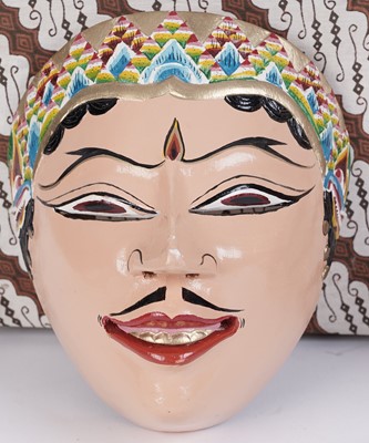 Lot 178 - A collection of vintage hand painted Indonesian Barong masks