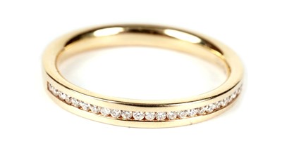 Lot 1243 - A diamond half hoop eternity ring