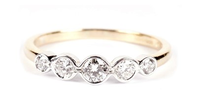 Lot 1244 - A five stone diamond ring