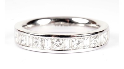 Lot 1250 - A diamond half hoop eternity ring
