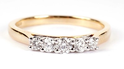Lot 1281 - A five stone diamond ring