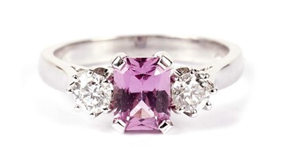 Lot 1282 - A pink sapphire and diamond three-stone ring