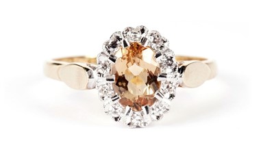 Lot 1284 - A yellow topaz and diamond cluster ring