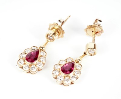 Lot 335 - A pair of ruby and diamond drop earrings