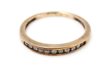 Lot 531 - A diamond half hoop eternity ring