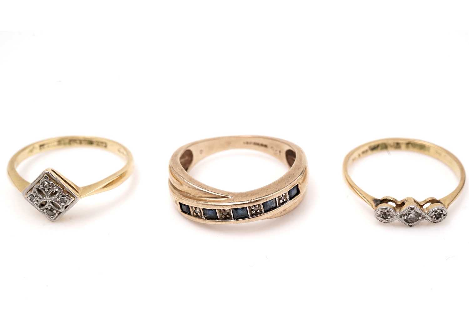 Lot 561 - Two diamond rings and a sapphire and diamond ring