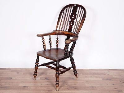 Lot 54 - A 19th Century stained-oak and elm bow-back Windsor chair