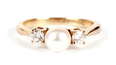 Lot 1081 - A cultured pearl and diamond ring