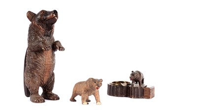 Lot 897 - A Black Forest carved wood nutcracker; a Black Forest ashtray; and a bear figure