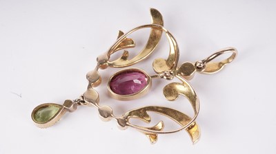 Lot 1085 - An Edwardian pink-tourmaline, peridot and seed-pearl pendant