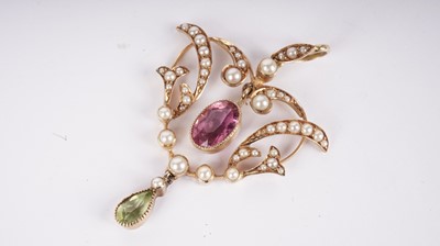 Lot 1085 - An Edwardian pink-tourmaline, peridot and seed-pearl pendant
