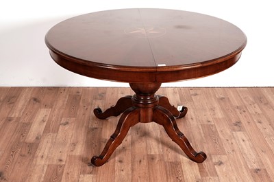 Lot 47 - A mahogany and satinwood inlaid circular extending dining table