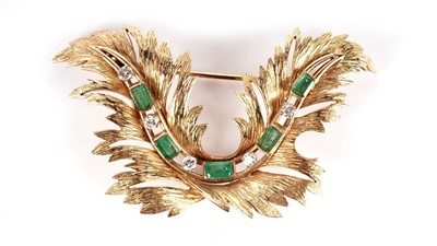 Lot 1087 - A gold, emerald and diamond brooch