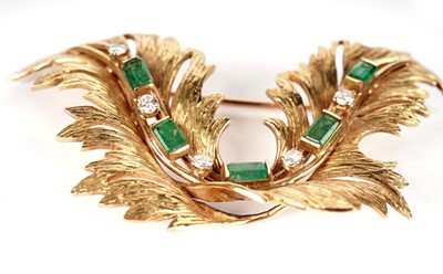 Lot 1087 - A gold, emerald and diamond brooch