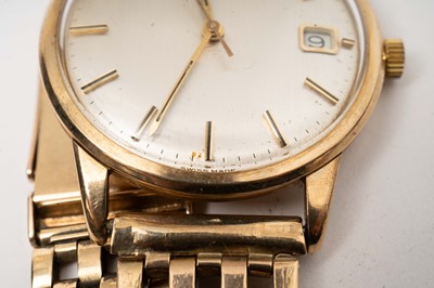 Lot 1061 - Omega: A 9ct yellow gold cased automatic wristwatch