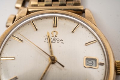 Lot 1061 - Omega: A 9ct yellow gold cased automatic wristwatch